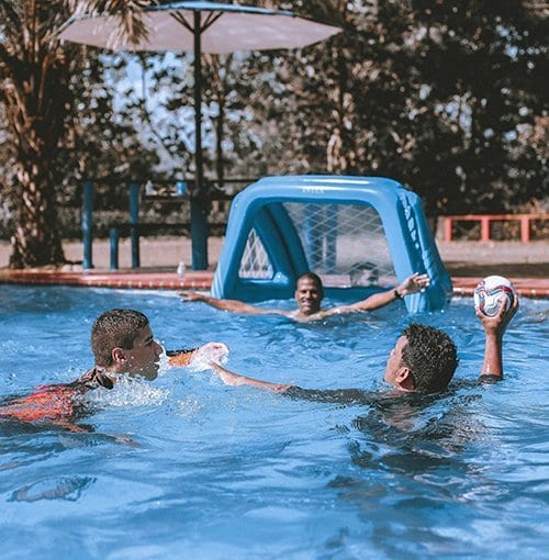 Boys playing in pool