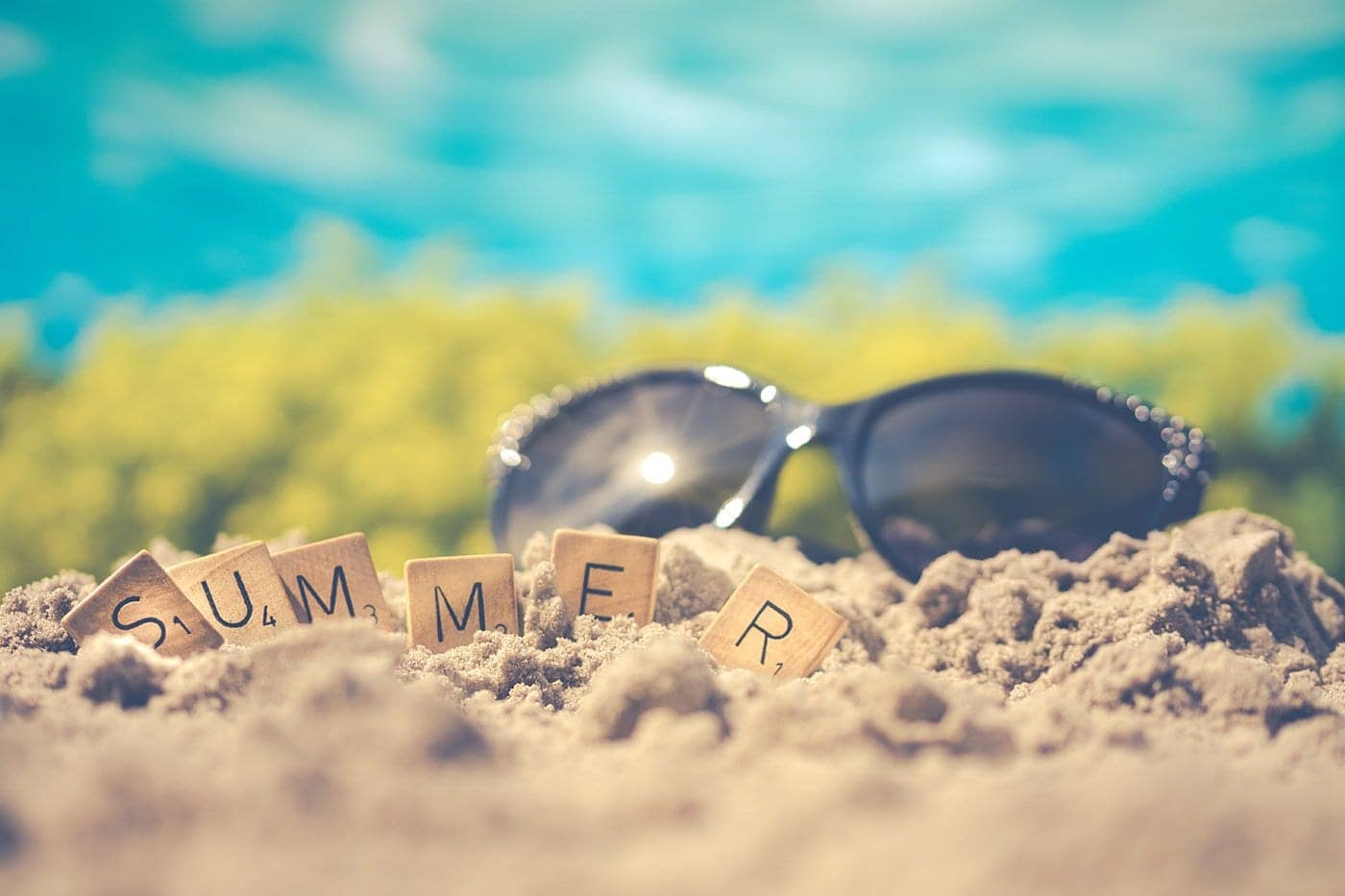 Sunglasses and beach sand