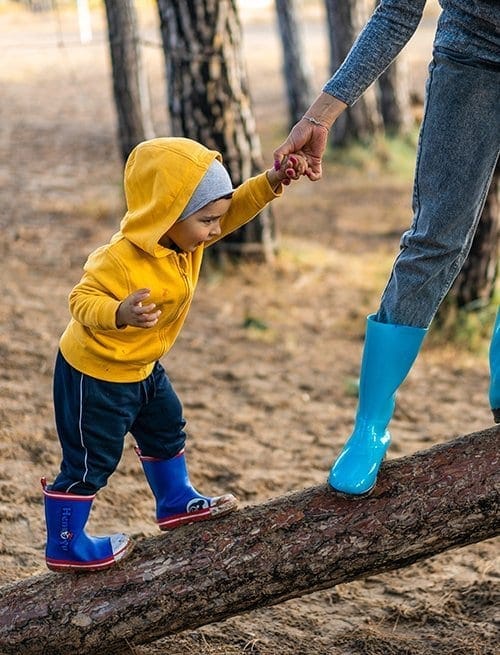 child on log